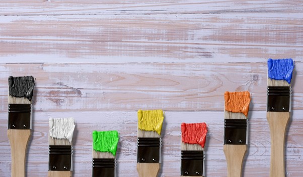 things to consider when renovating in summer, paint brushes and paint from unsplash