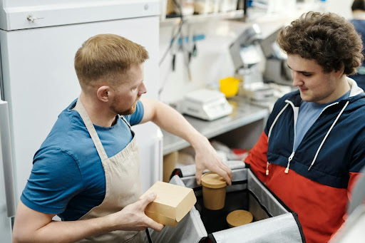 men packing a food order, fat joe stock