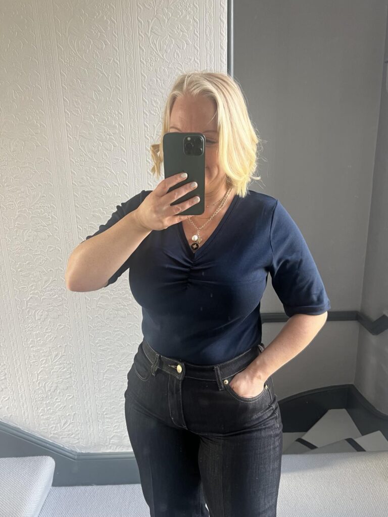 cotton traders uk review, wearing v-neck ruched top in the mirror
