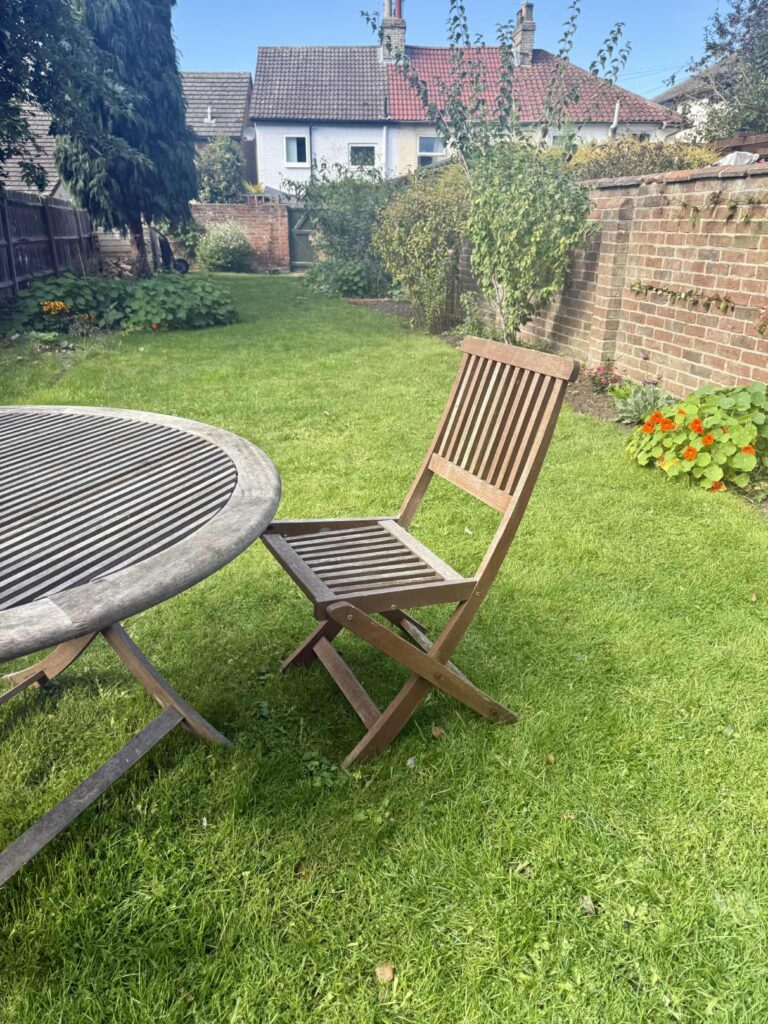 garden view with wooden chair in Ipswich dentist for patients